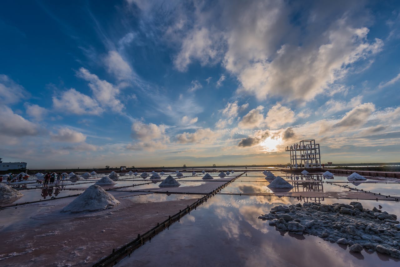 Blue sky above salt fields in evening